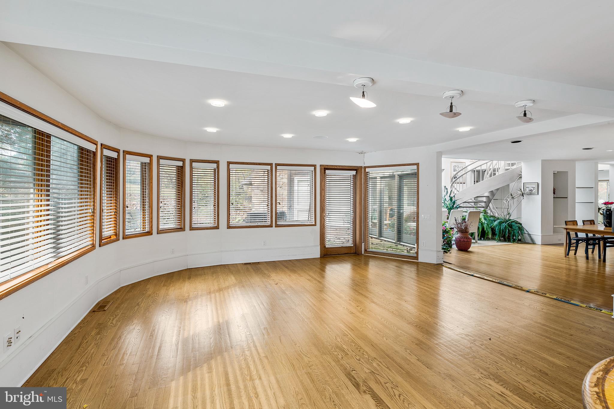 655 Matsonford Road Villanova, PA 19085 - Photo 21 of 63 a view of an empty room with wooden floor and a window