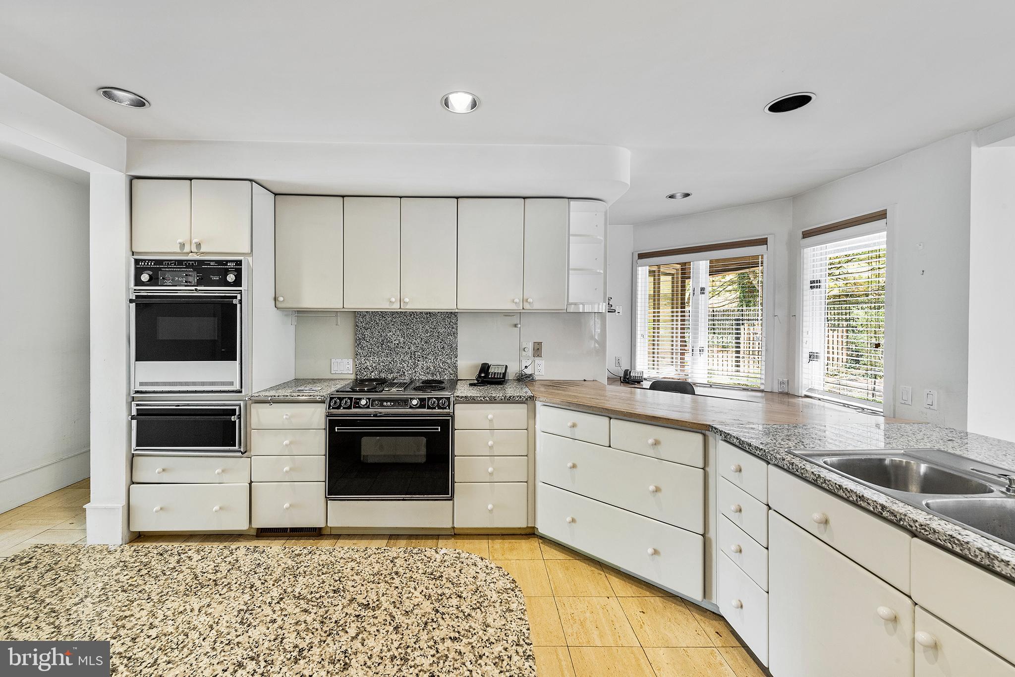 655 Matsonford Road Villanova, PA 19085 - Photo 23 of 63 a kitchen with a sink stove and cabinets