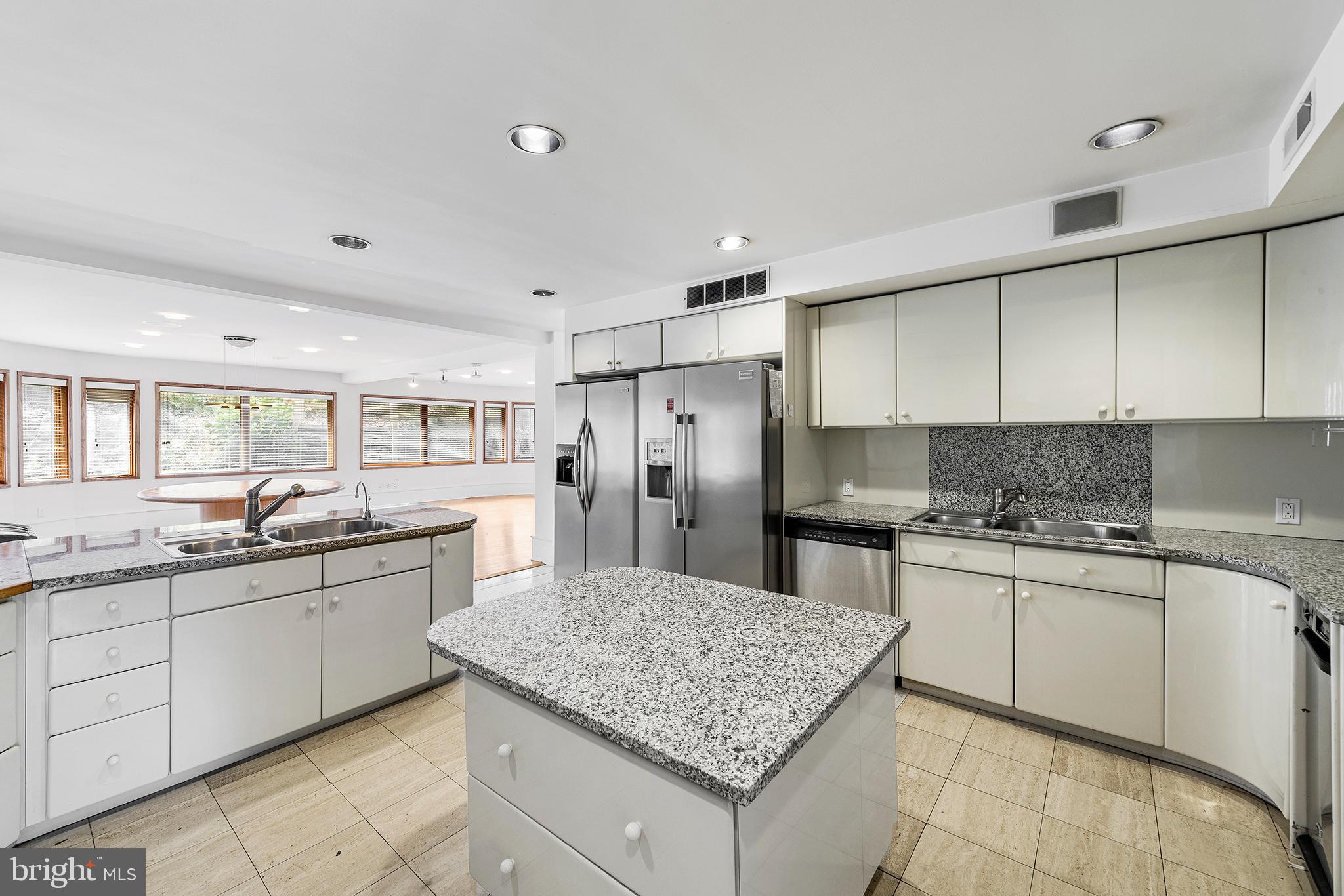 655 Matsonford Road Villanova, PA 19085 - Photo 25 of 63 a kitchen with stainless steel appliances granite countertop a sink stove and refrigerator