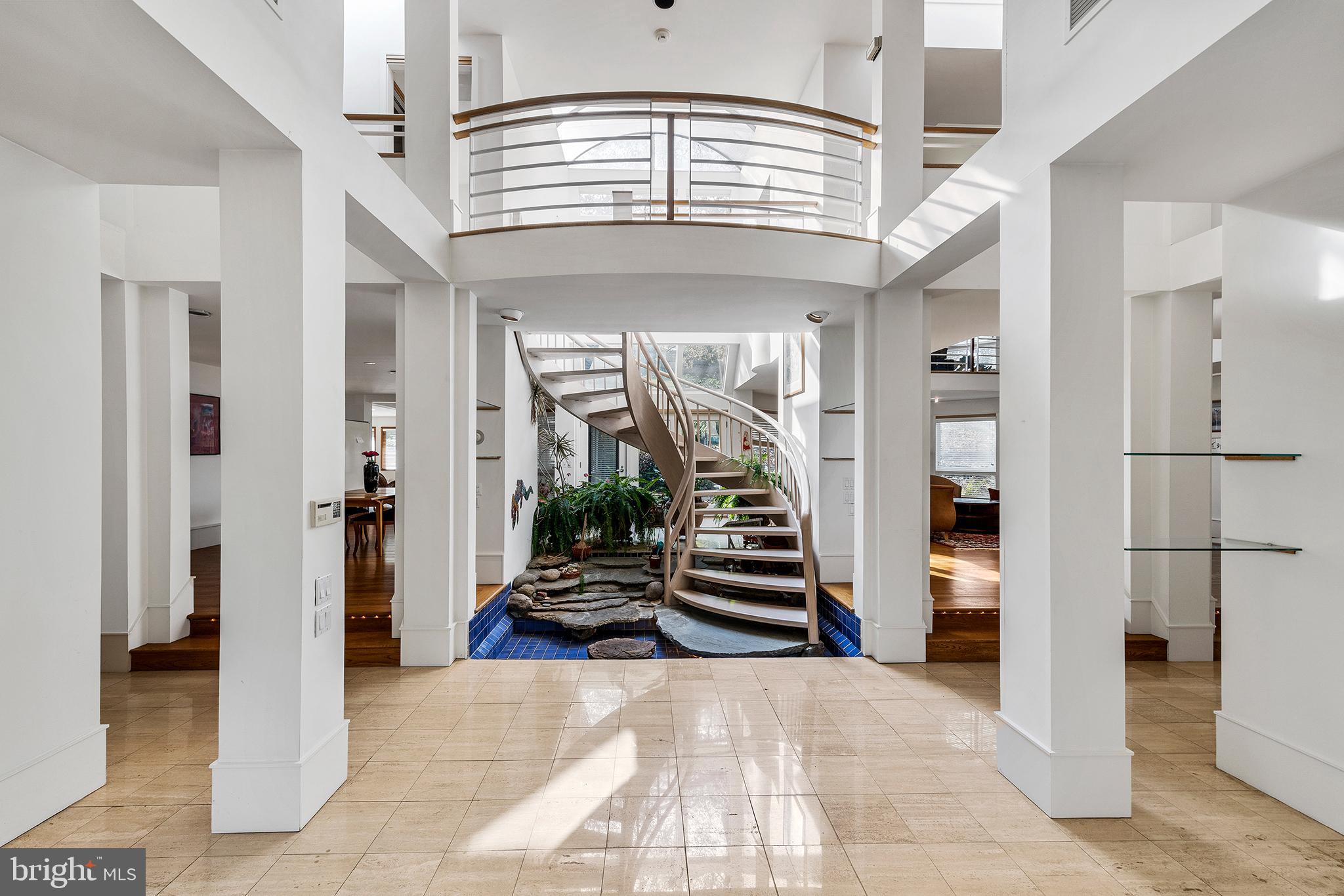 655 Matsonford Road Villanova, PA 19085 - Photo 31 of 63 a view of a hallway with wooden floor and stairs
