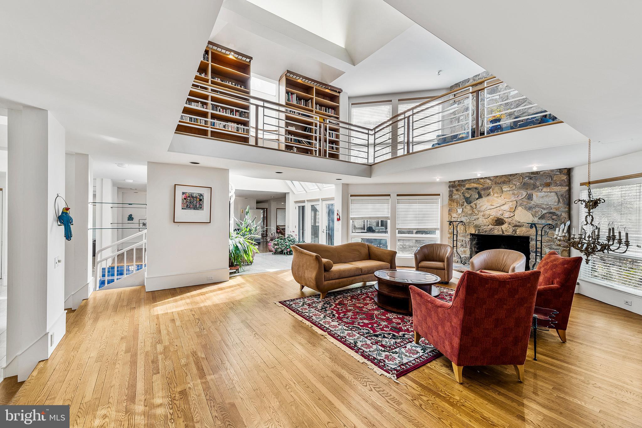 655 Matsonford Road Villanova, PA 19085 - Photo 36 of 63 a living room with fireplace furniture and a wooden floor