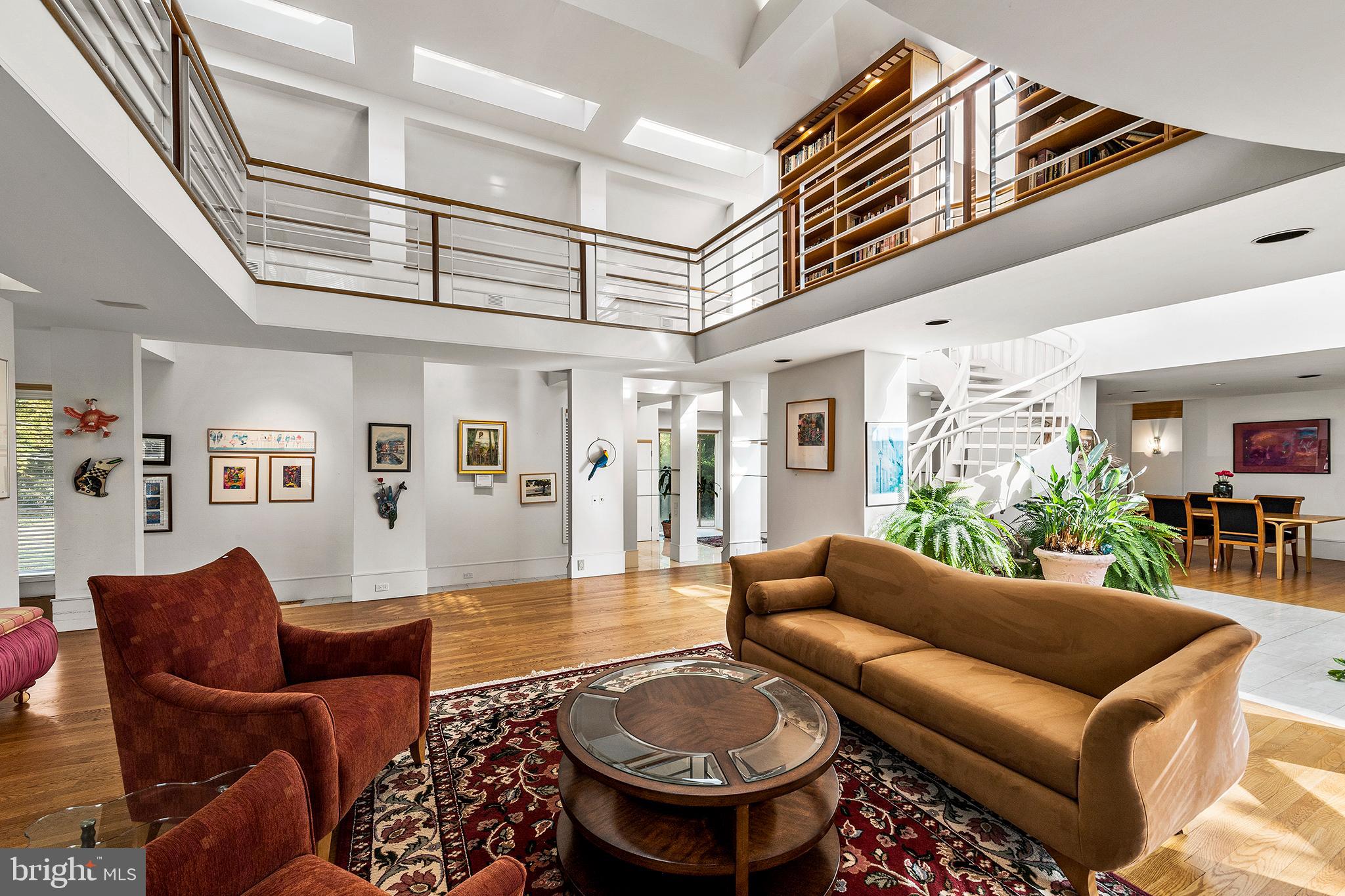 655 Matsonford Road Villanova, PA 19085 - Photo 37 of 63 a living room with furniture a chandelier and a rug
