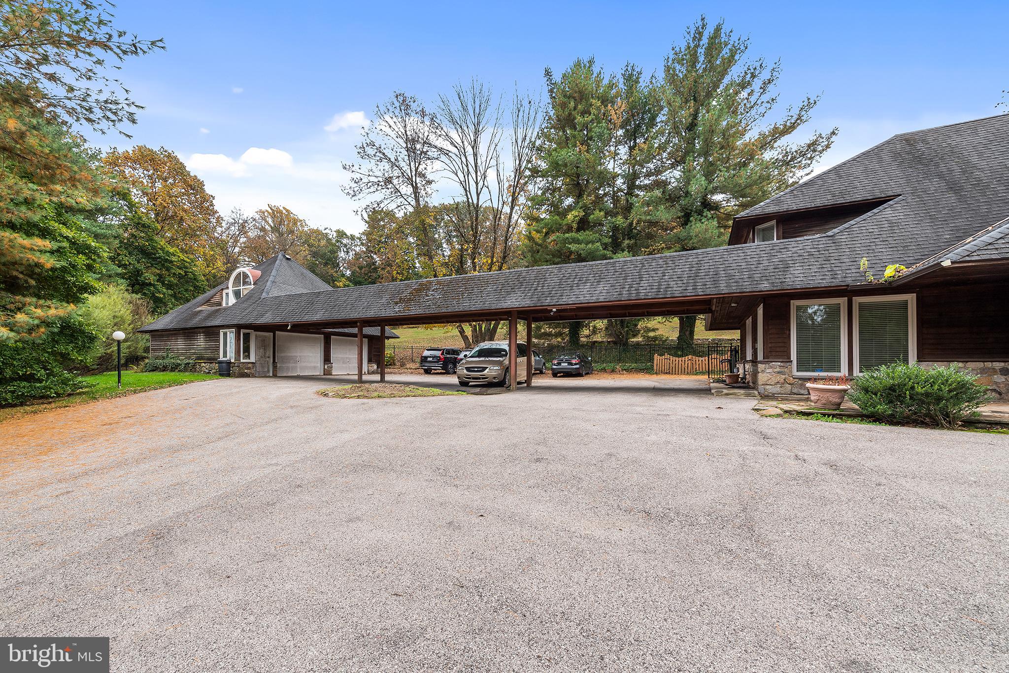 655 Matsonford Road Villanova, PA 19085 - Photo 4 of 63 a view of a house with large windows and a small yard