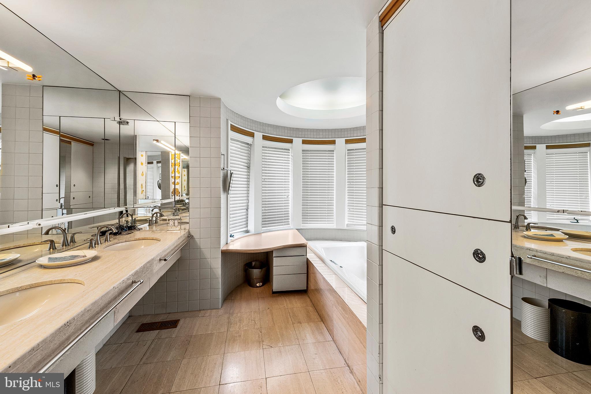 655 Matsonford Road Villanova, PA 19085 - Photo 42 of 63 a bathroom with a tub sink shower and mirror
