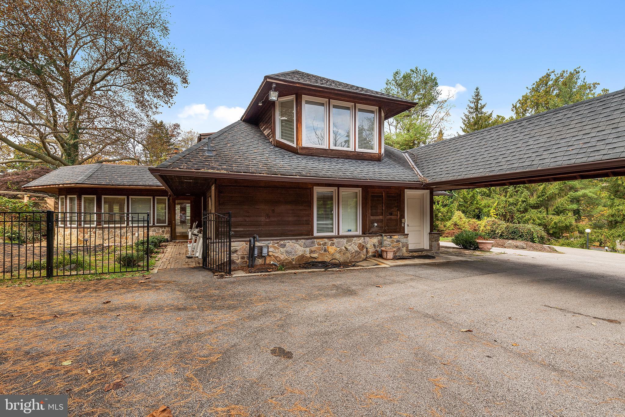 655 Matsonford Road Villanova, PA 19085 - Photo 5 of 63 a front view of a house with a garden and outdoor seating