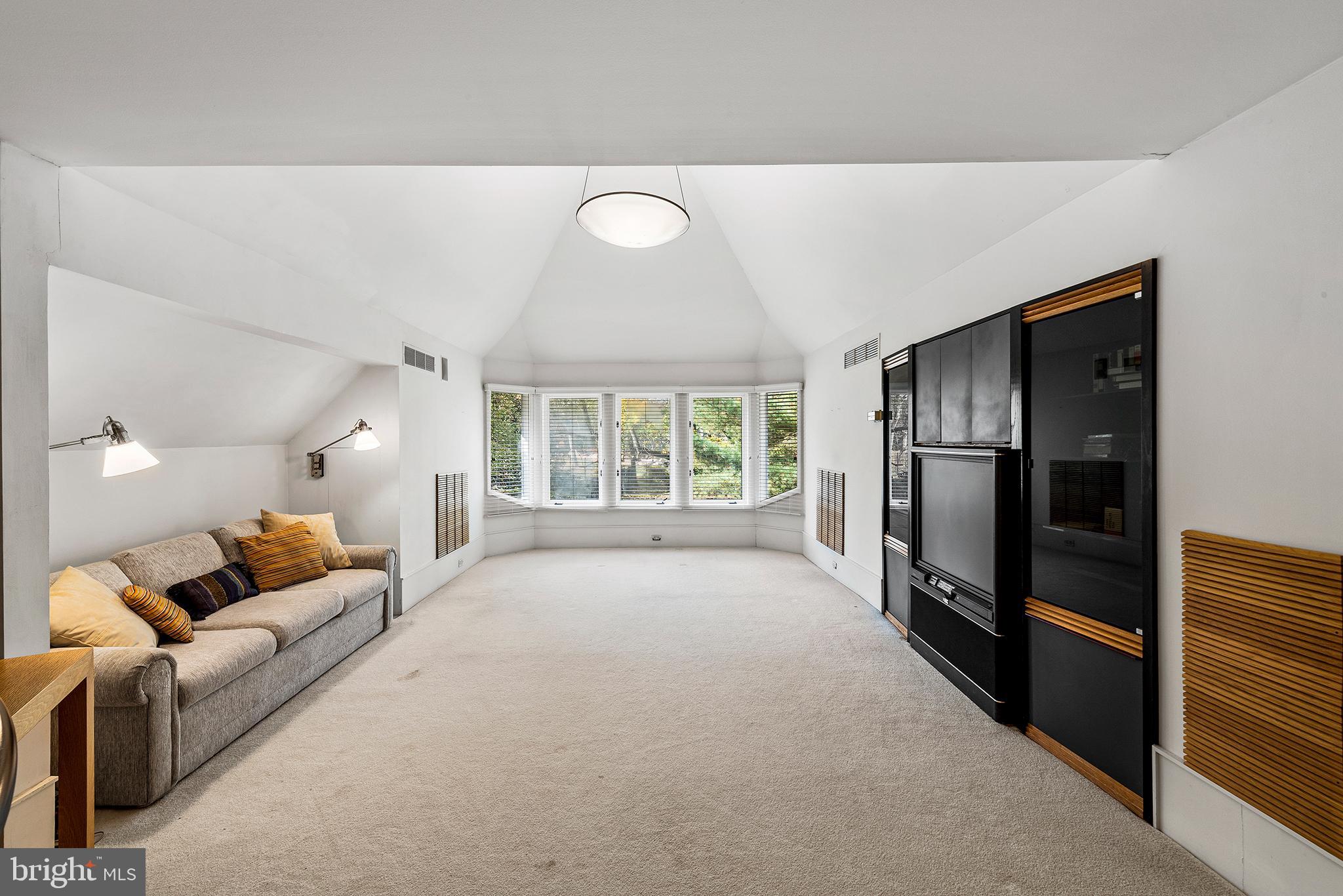655 Matsonford Road Villanova, PA 19085 - Photo 52 of 63 a living room with furniture windows and a refrigerator