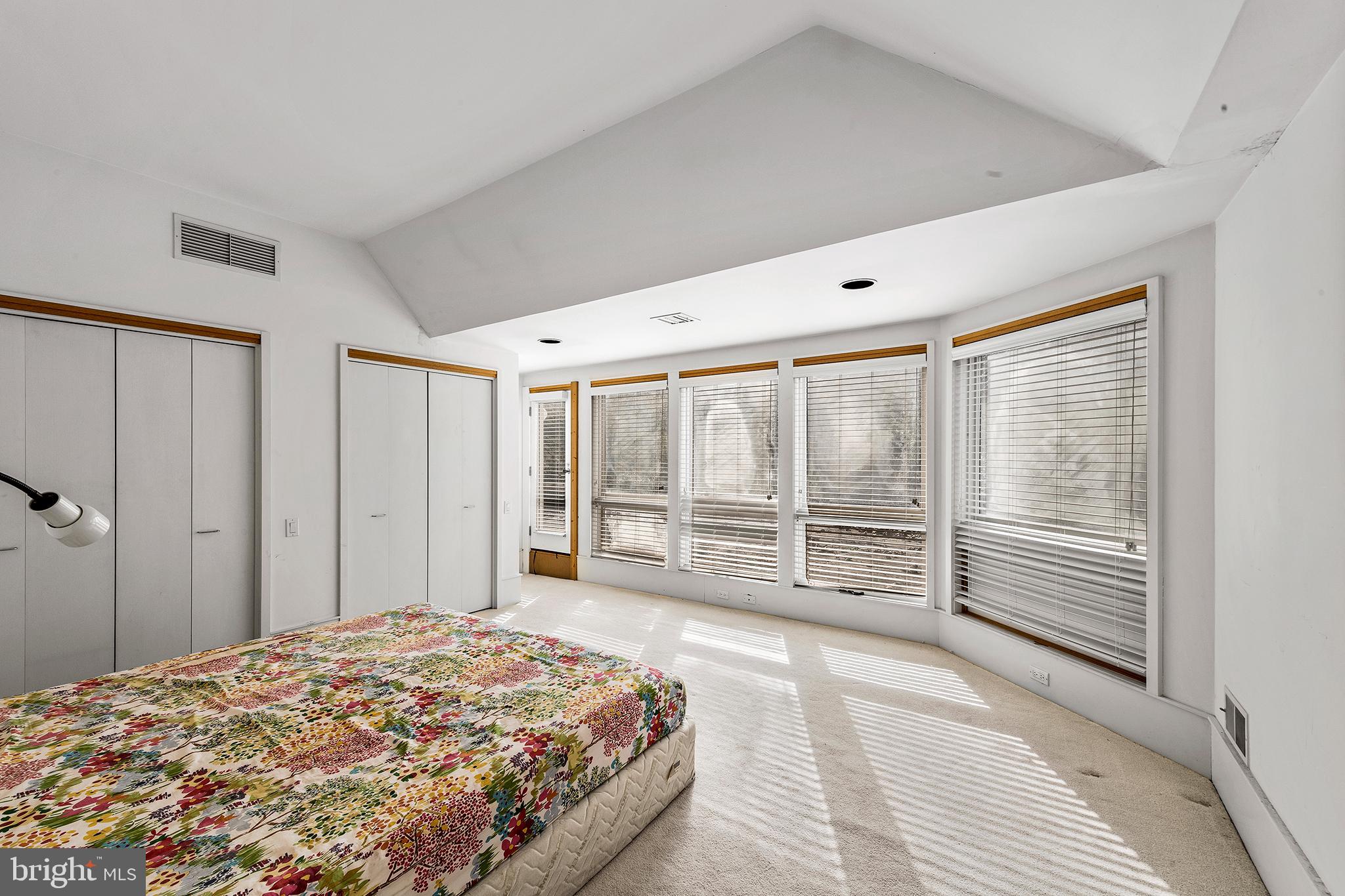 655 Matsonford Road Villanova, PA 19085 - Photo 60 of 63 a bedroom with a large bed and a large window