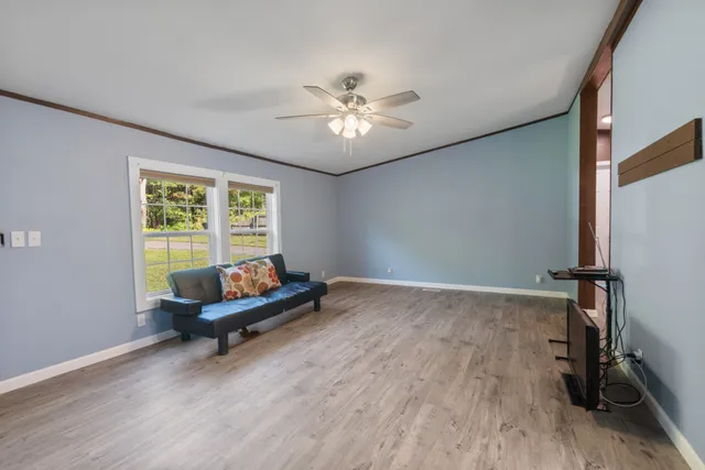 a living room with furniture and a window