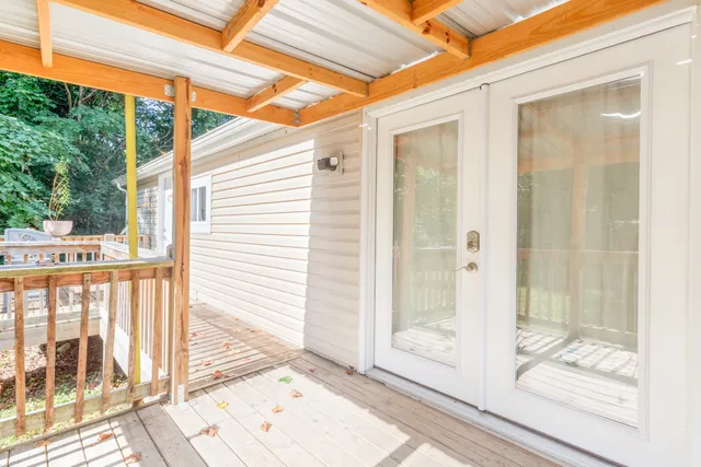 a view of a balcony with a glass door
