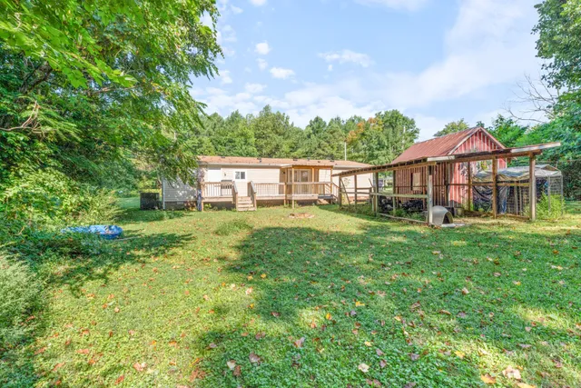 a view of a house with a big yard