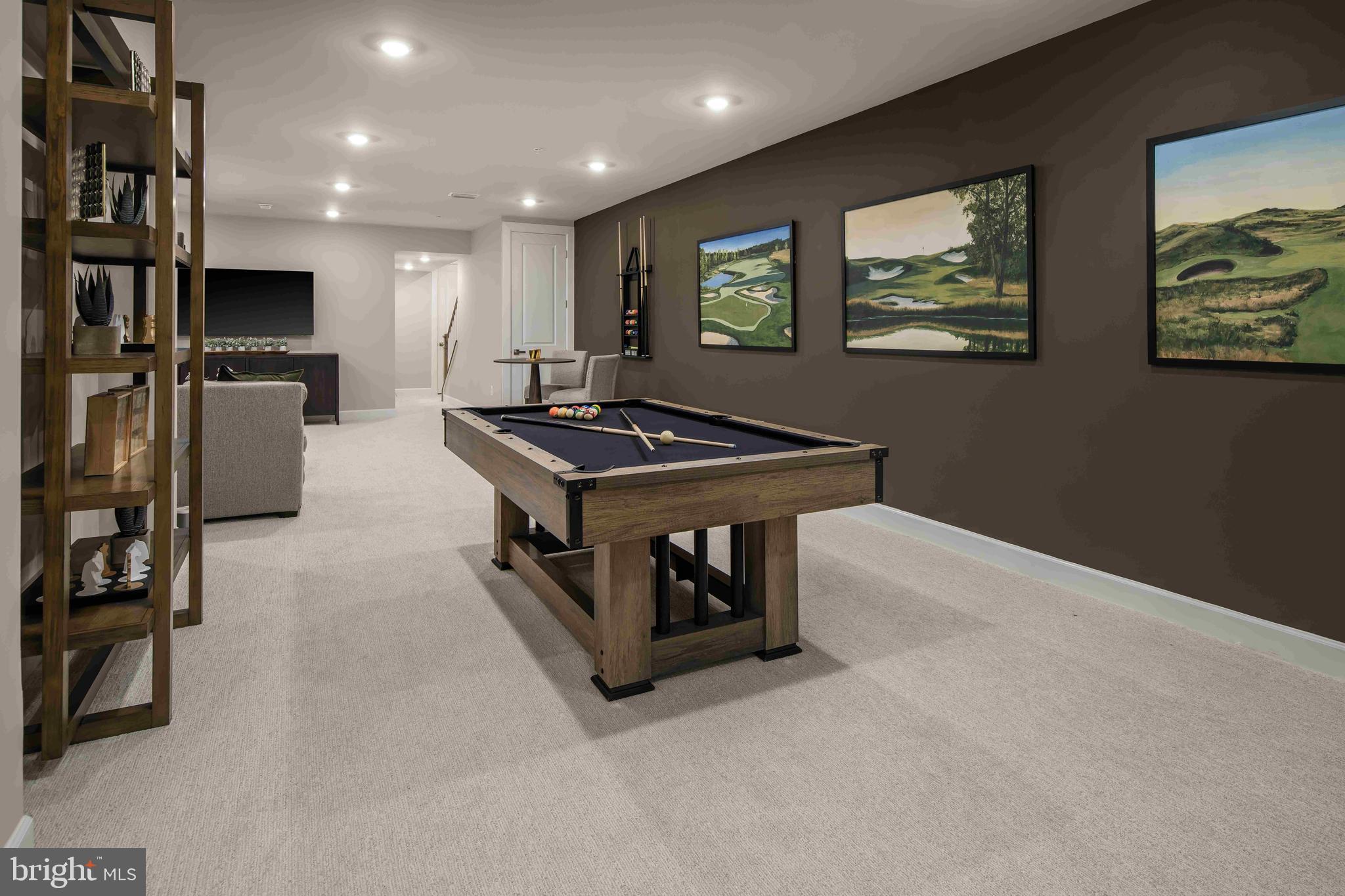 9676 Wishing Well Lane Ellicott City, MD 21042 - Photo 16 of 25 a kitchen with stainless steel appliances a stove a refrigerator and a refrigerator