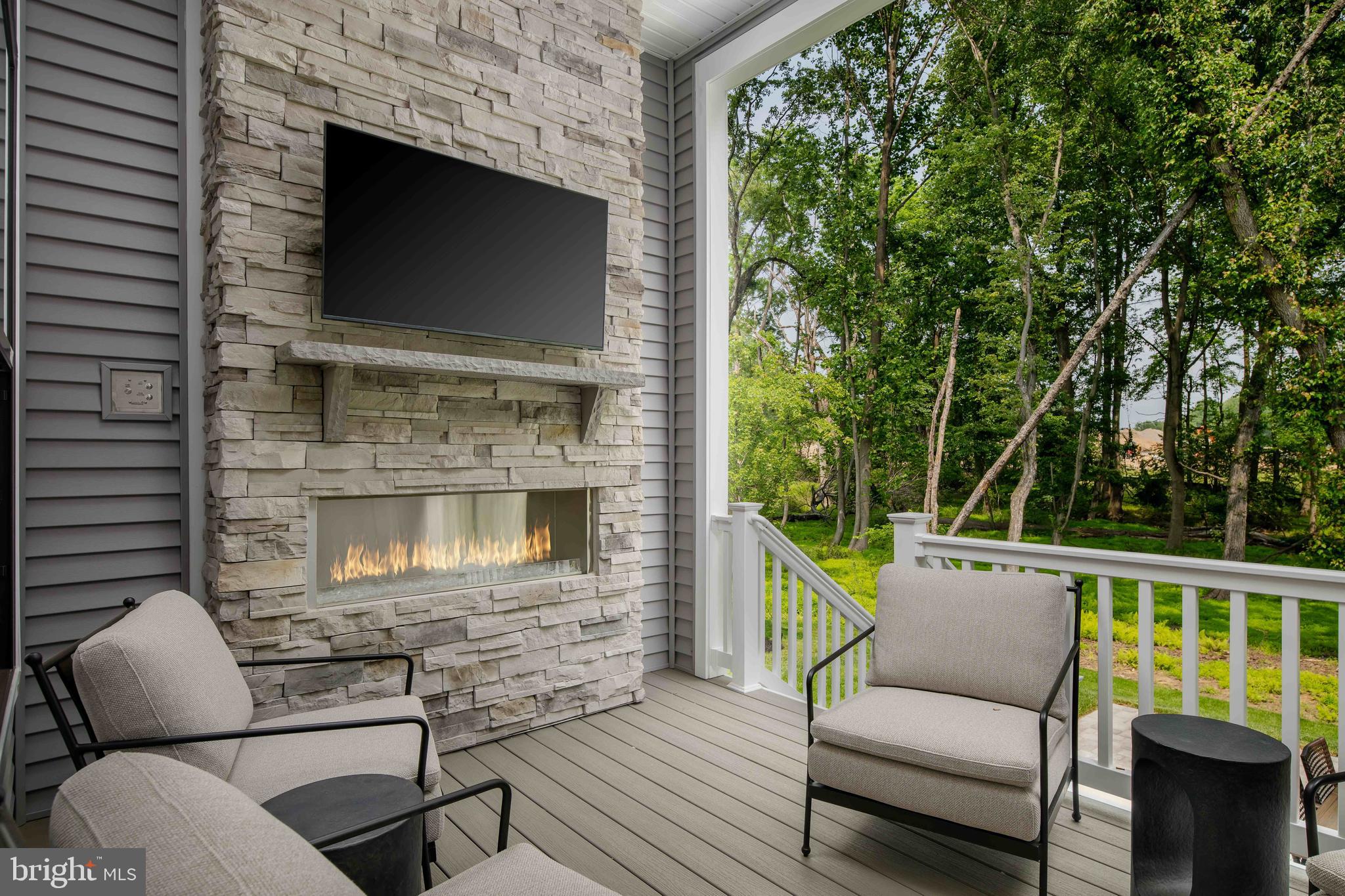 9676 Wishing Well Lane Ellicott City, MD 21042 - Photo 18 of 25 a view of a chair and table in the balcony