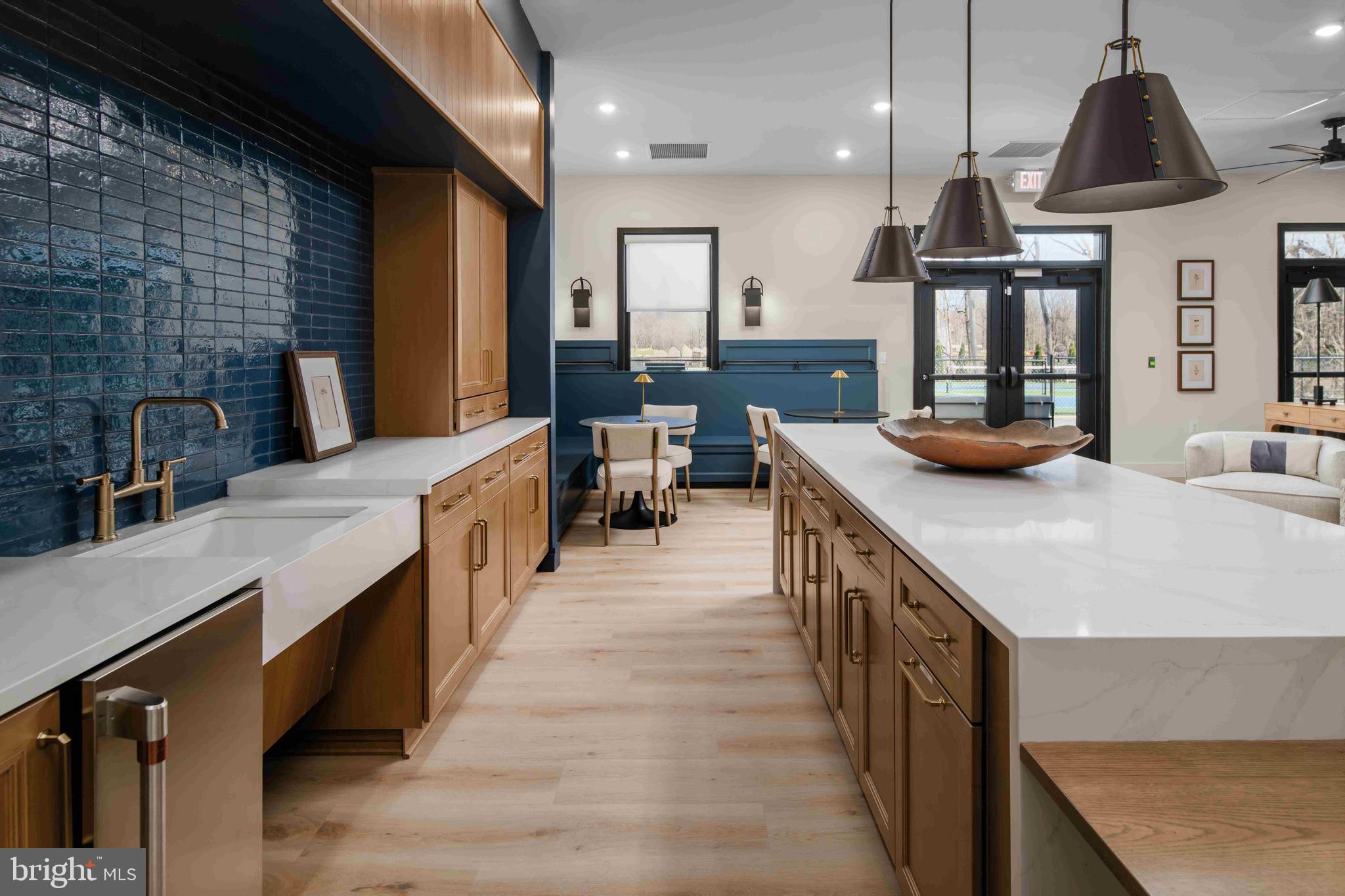 9676 Wishing Well Lane Ellicott City, MD 21042 - Photo 21 of 25 a kitchen with counter top space a sink appliances and cabinets