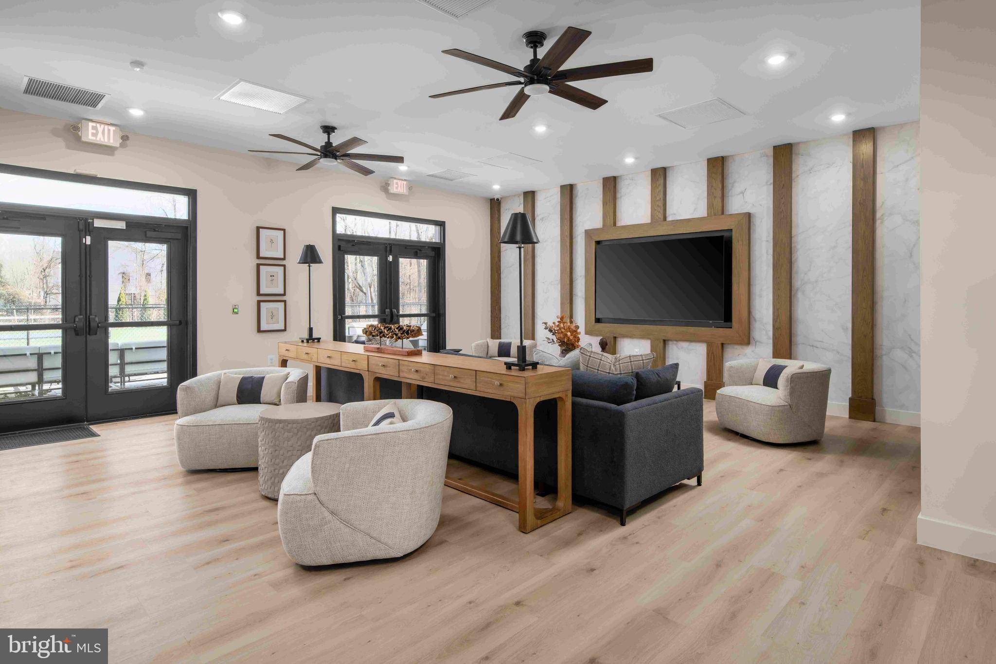 9676 Wishing Well Lane Ellicott City, MD 21042 - Photo 22 of 25 a living room with furniture and a flat screen tv