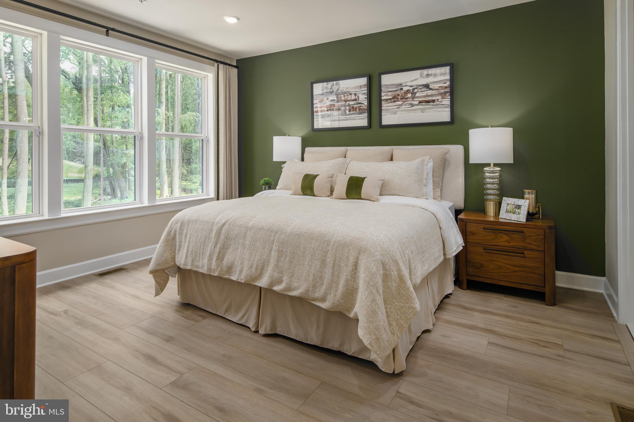9676 Wishing Well Lane Ellicott City, MD 21042 - Photo 5 of 25 a bedroom with a bed wooden floor and window
