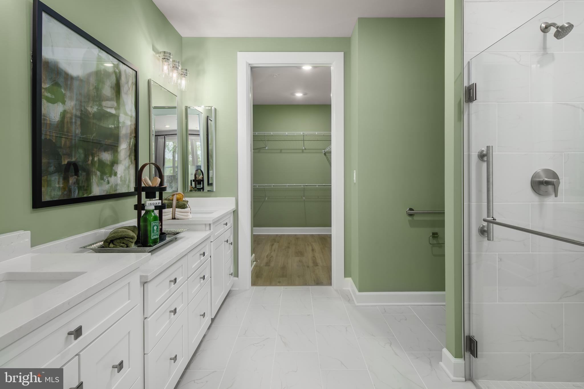 9676 Wishing Well Lane Ellicott City, MD 21042 - Photo 6 of 25 a bathroom with a granite countertop shower sink and mirror