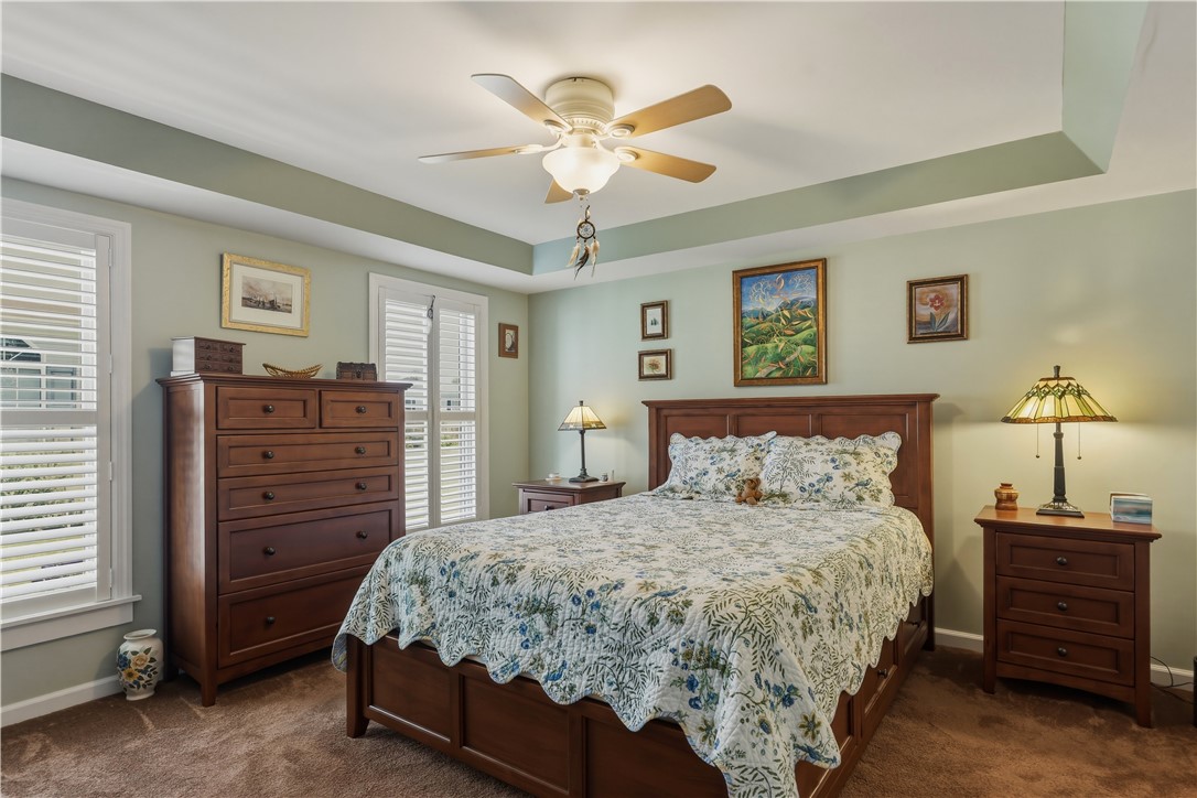 136 Rocking Chair Road Big Flats, NY 14845 - Photo 17 of 38 A beautiful Primary Suite features a tray ceiling and very spacious bath.