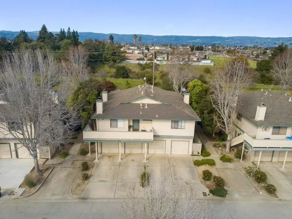 a aerial view of a house with a lake view