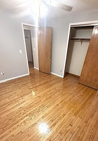 a view of room with wooden floor