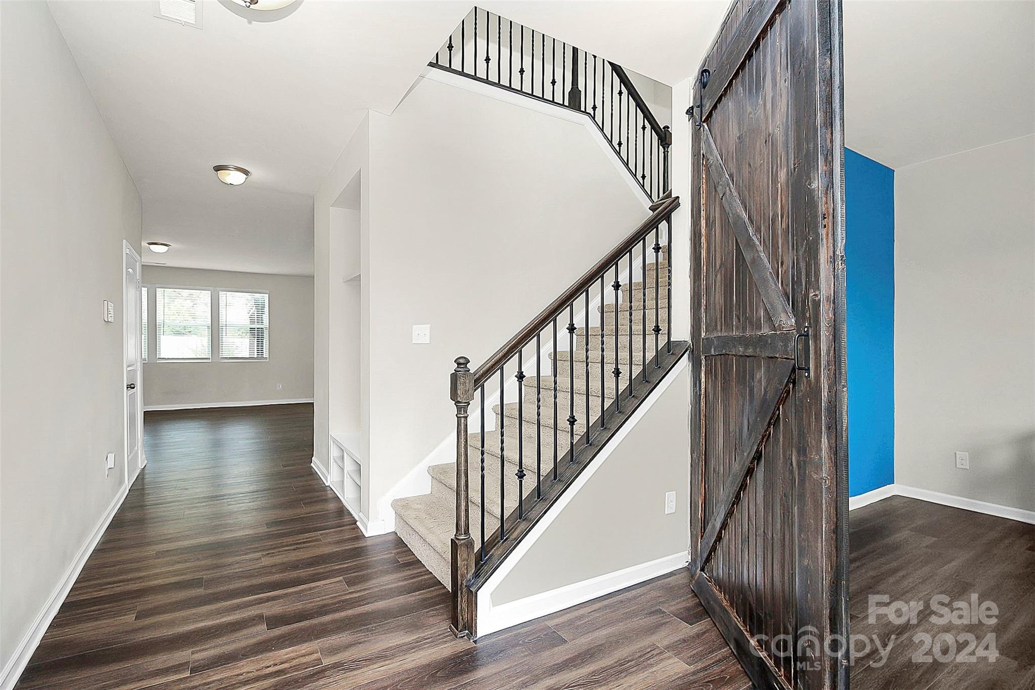 1769 Bailey Ridge Drive York, SC 29745 - Photo 11 of 47 a view of a hallway with wooden floor and staircase
