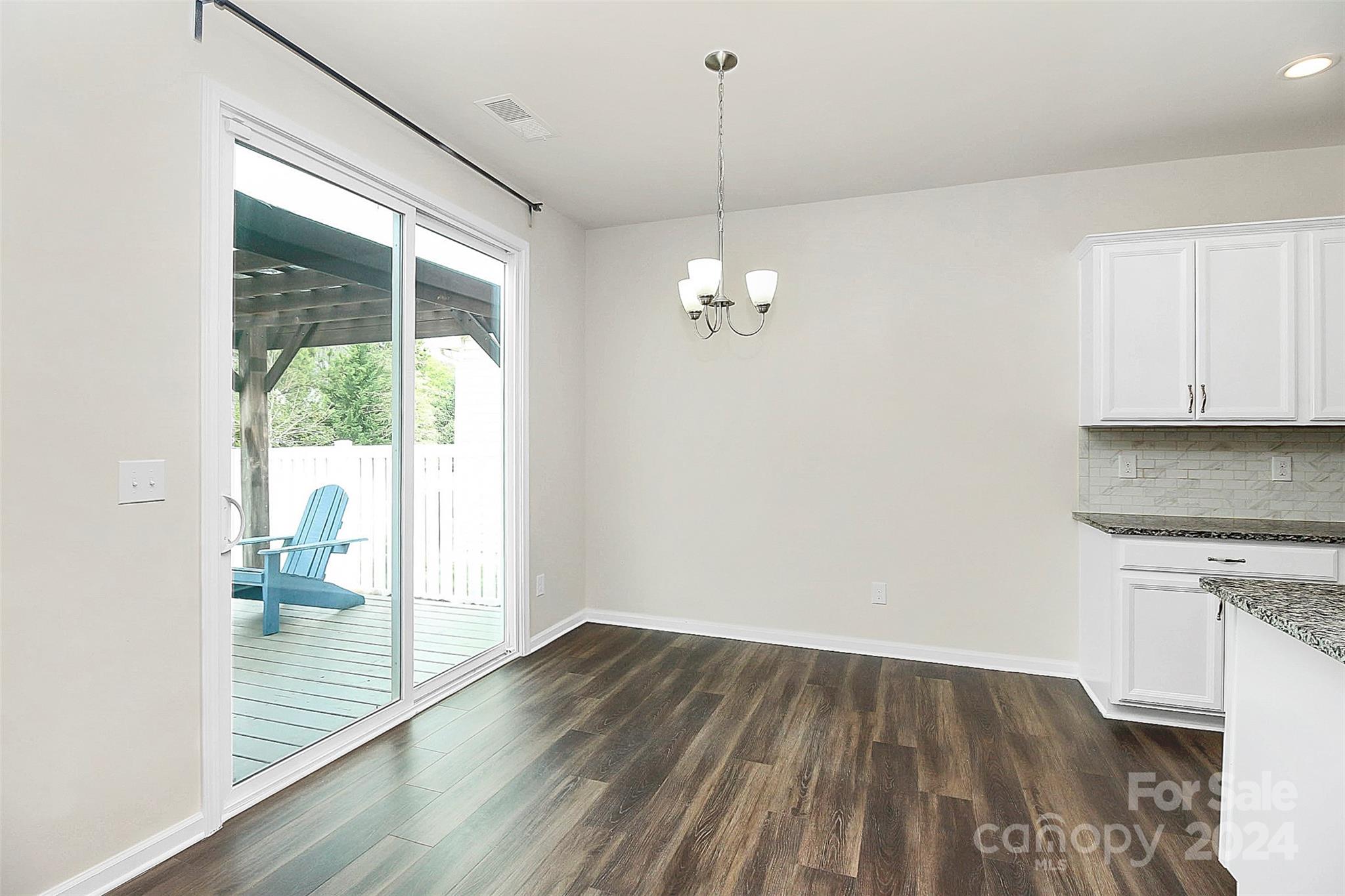 1769 Bailey Ridge Drive York, SC 29745 - Photo 15 of 47 an empty room with wooden floor and windows