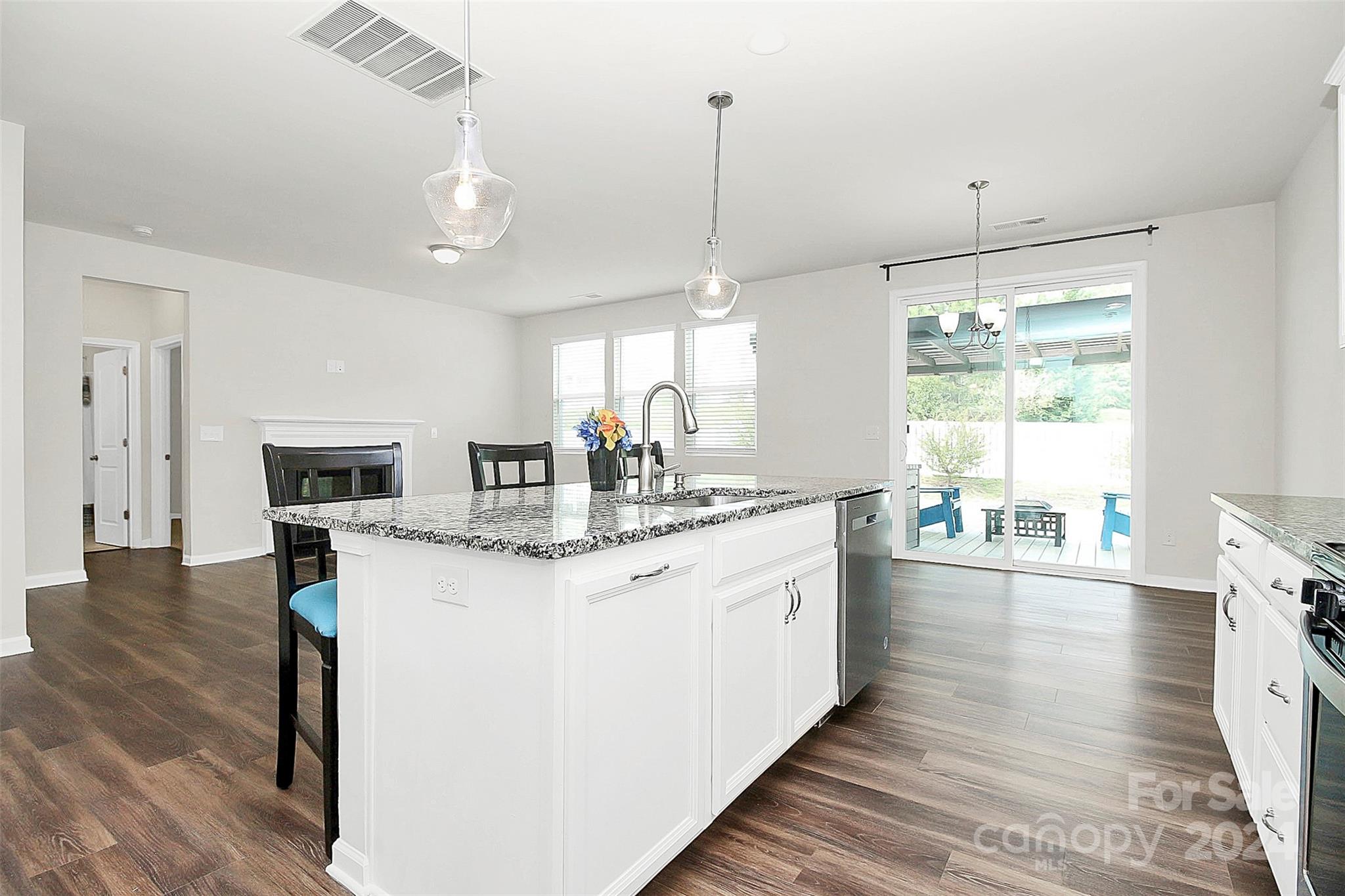 1769 Bailey Ridge Drive York, SC 29745 - Photo 19 of 47 a kitchen with kitchen island granite countertop a sink appliances and cabinets