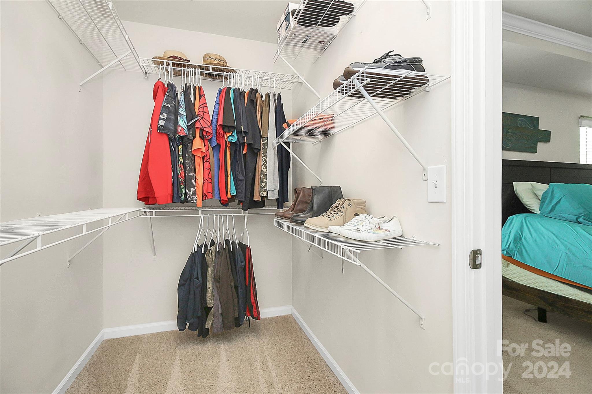 1769 Bailey Ridge Drive York, SC 29745 - Photo 35 of 47 a view of walk in closet with clothes and shoes