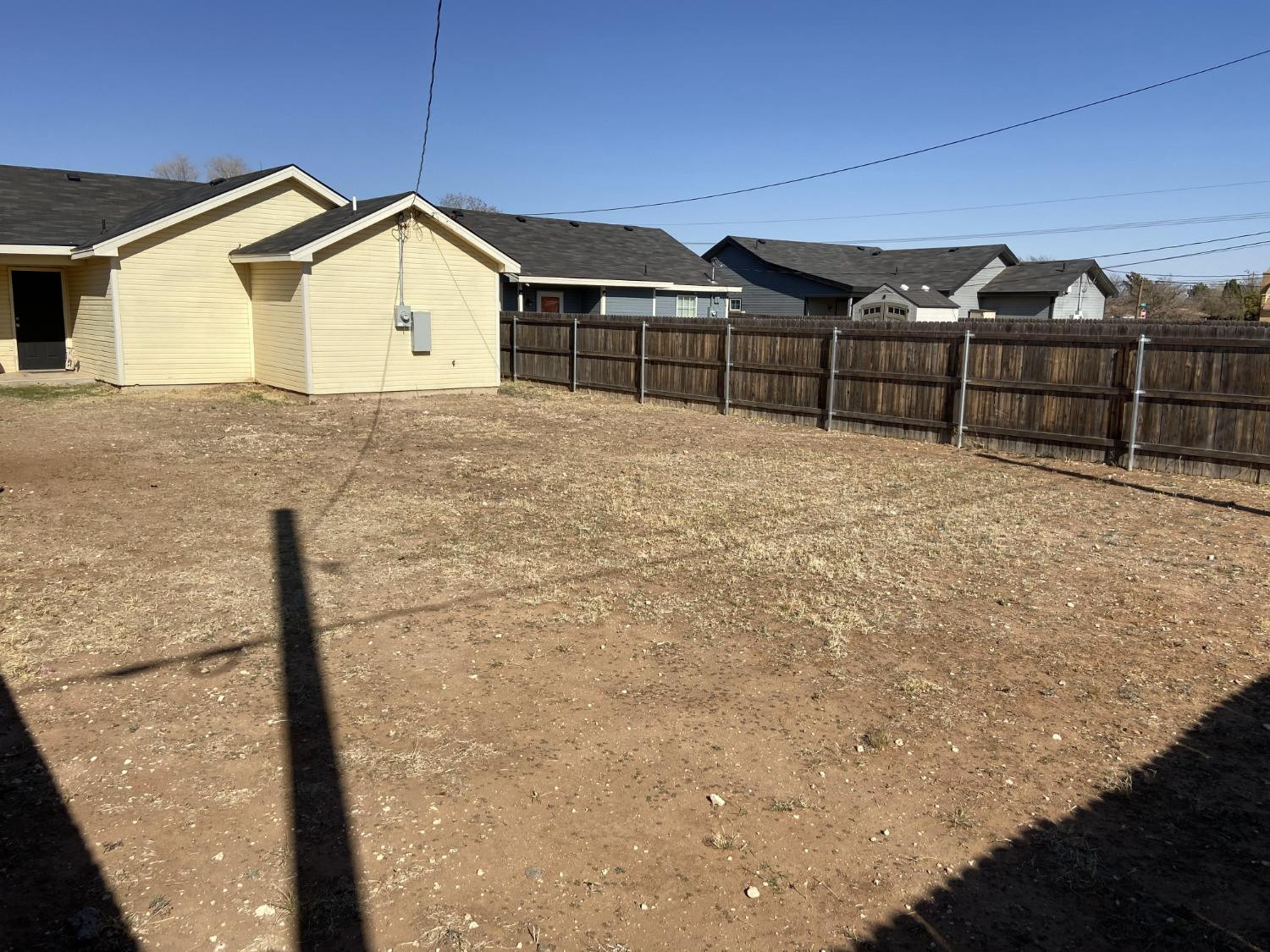 2709 Cornell Street Lubbock, TX 79415 - Photo 14 of 28 a view of a brick house with wooden fence