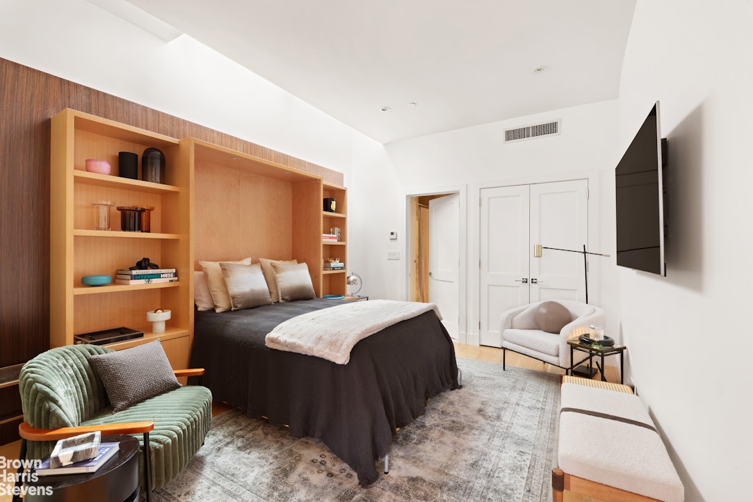 7 East 17th Street, Unit PHS Manhattan, NY 10003 - Photo 10 of 26 a bedroom with furniture and a couch