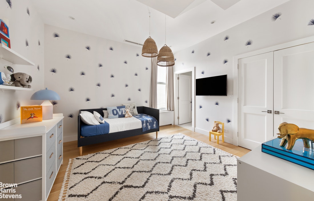 7 East 17th Street, Unit PHS Manhattan, NY 10003 - Photo 13 of 26 a living room with furniture and a flat screen tv