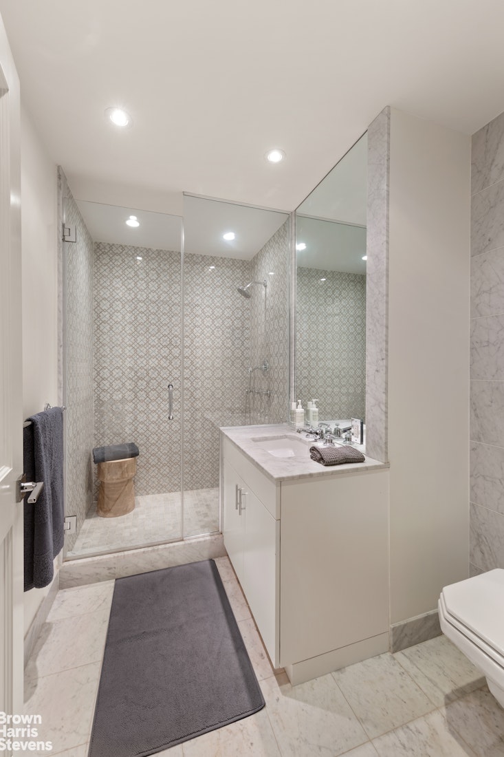 7 East 17th Street, Unit PHS Manhattan, NY 10003 - Photo 14 of 26 a bathroom with a sink a toilet and shower