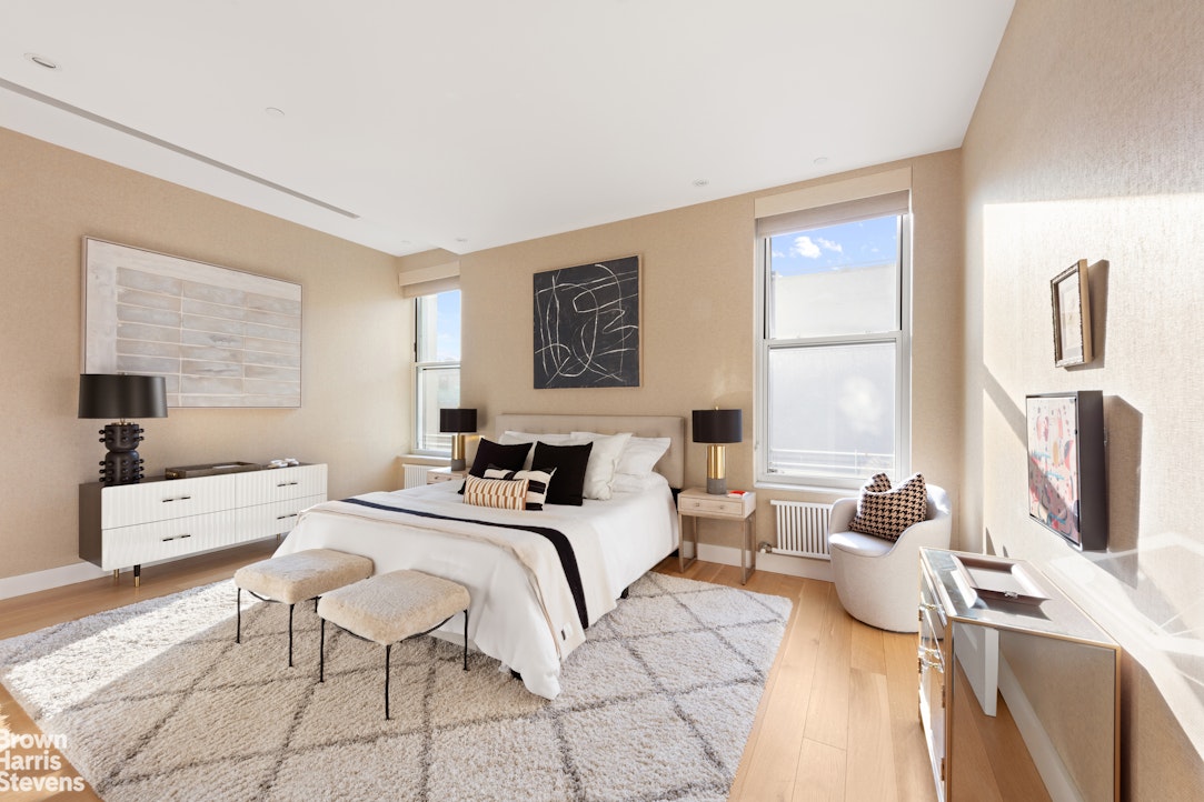 7 East 17th Street, Unit PHS Manhattan, NY 10003 - Photo 15 of 26 a bedroom with a bed and wooden floor