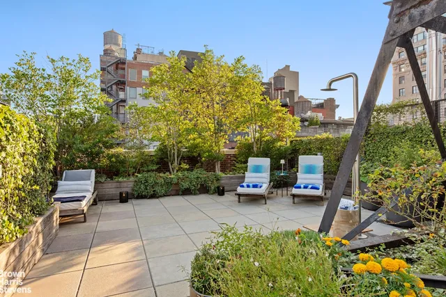 a view of a chairs and table in the balcony