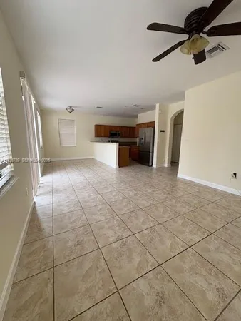 a view of a kitchen with a sink and a window