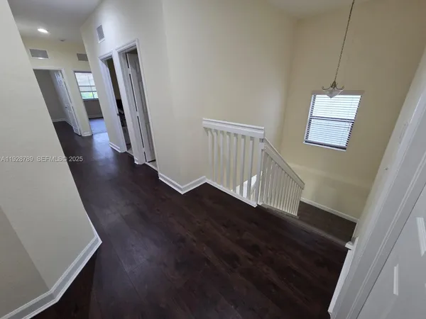 a view of entryway with wooden floor