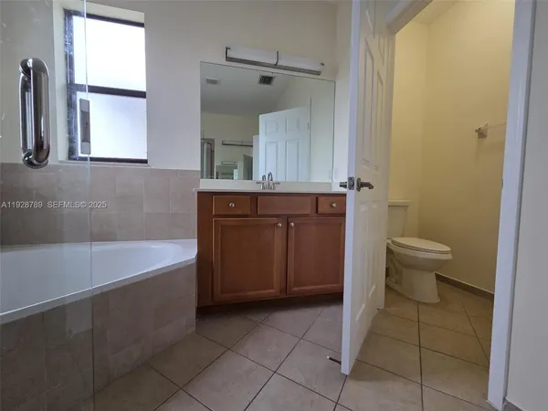 a bathroom with a sink a toilet and a bathtub