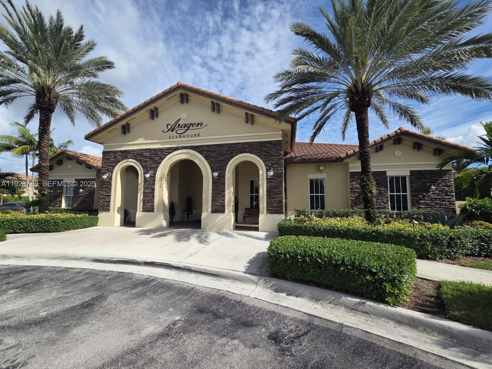 8841 West 34th Court Hialeah, FL 33018 - Photo 27 of 48 a front view of a house with a yard and garage