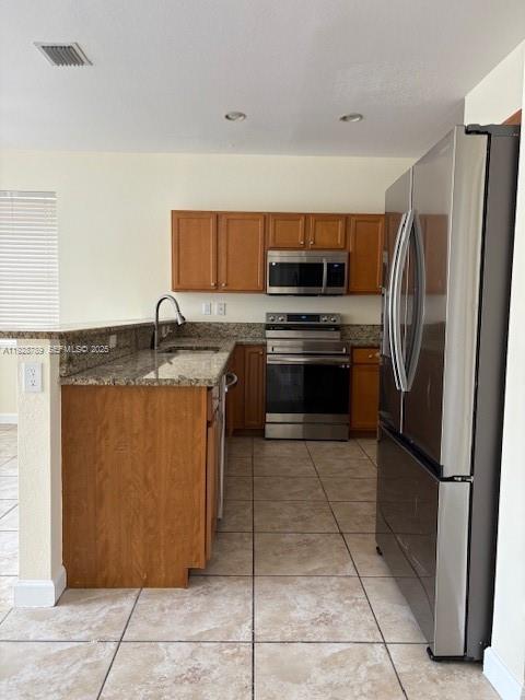 8841 West 34th Court Hialeah, FL 33018 - Photo 44 of 48 a kitchen with stainless steel appliances granite countertop a refrigerator and a sink