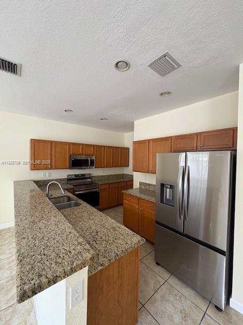 8841 West 34th Court Hialeah, FL 33018 - Photo 45 of 48 a kitchen with stainless steel appliances granite countertop a sink stove and refrigerator