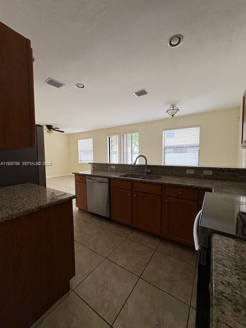 8841 West 34th Court Hialeah, FL 33018 - Photo 5 of 48 a kitchen with stainless steel appliances granite countertop a sink and a stove