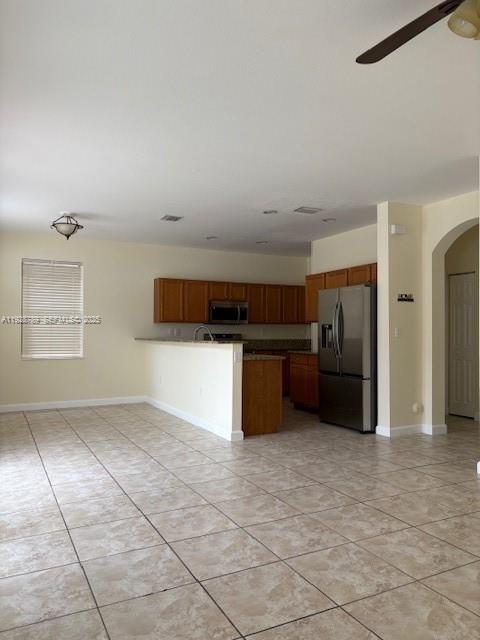 8841 West 34th Court Hialeah, FL 33018 - Photo 9 of 48 a kitchen with granite countertop a refrigerator and cabinets
