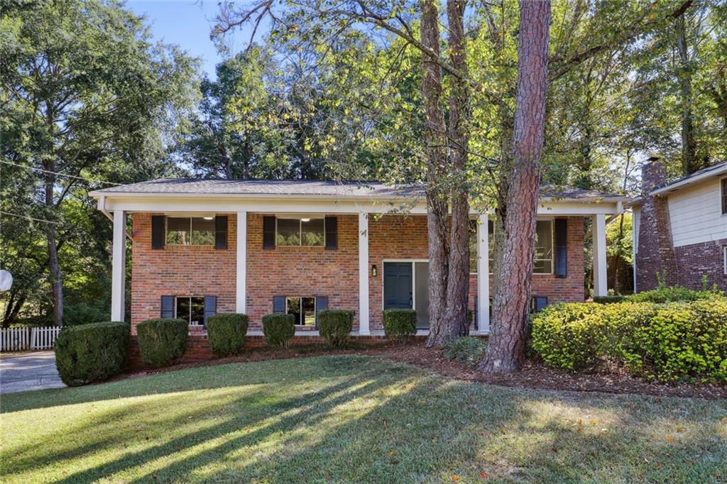 front view of a house with a yard
