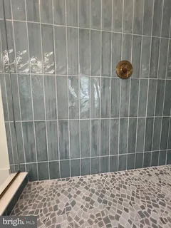 a bathroom with a bathtub and a sink