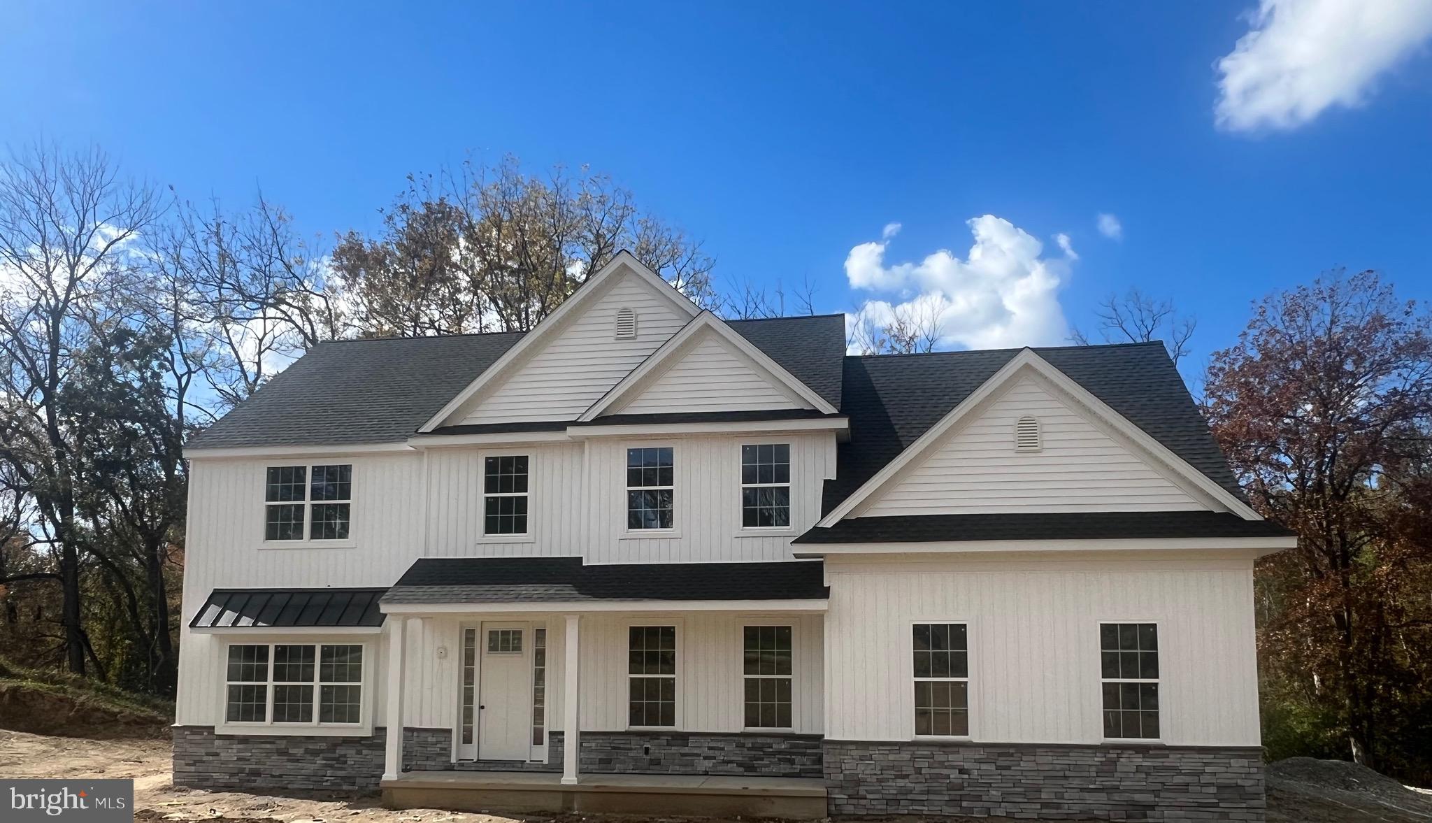 183 Ellicott Road Avondale, PA 19311 - Photo 2 of 92 a front view of a house with a yard