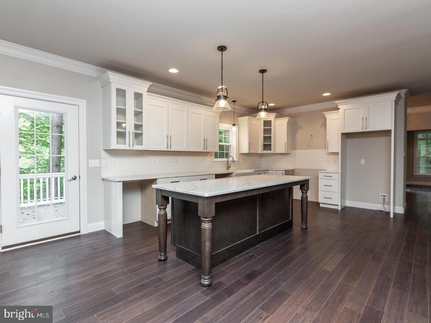 183 Ellicott Road Avondale, PA 19311 - Photo 25 of 92 a kitchen with kitchen island a sink stainless steel appliances and wooden floor