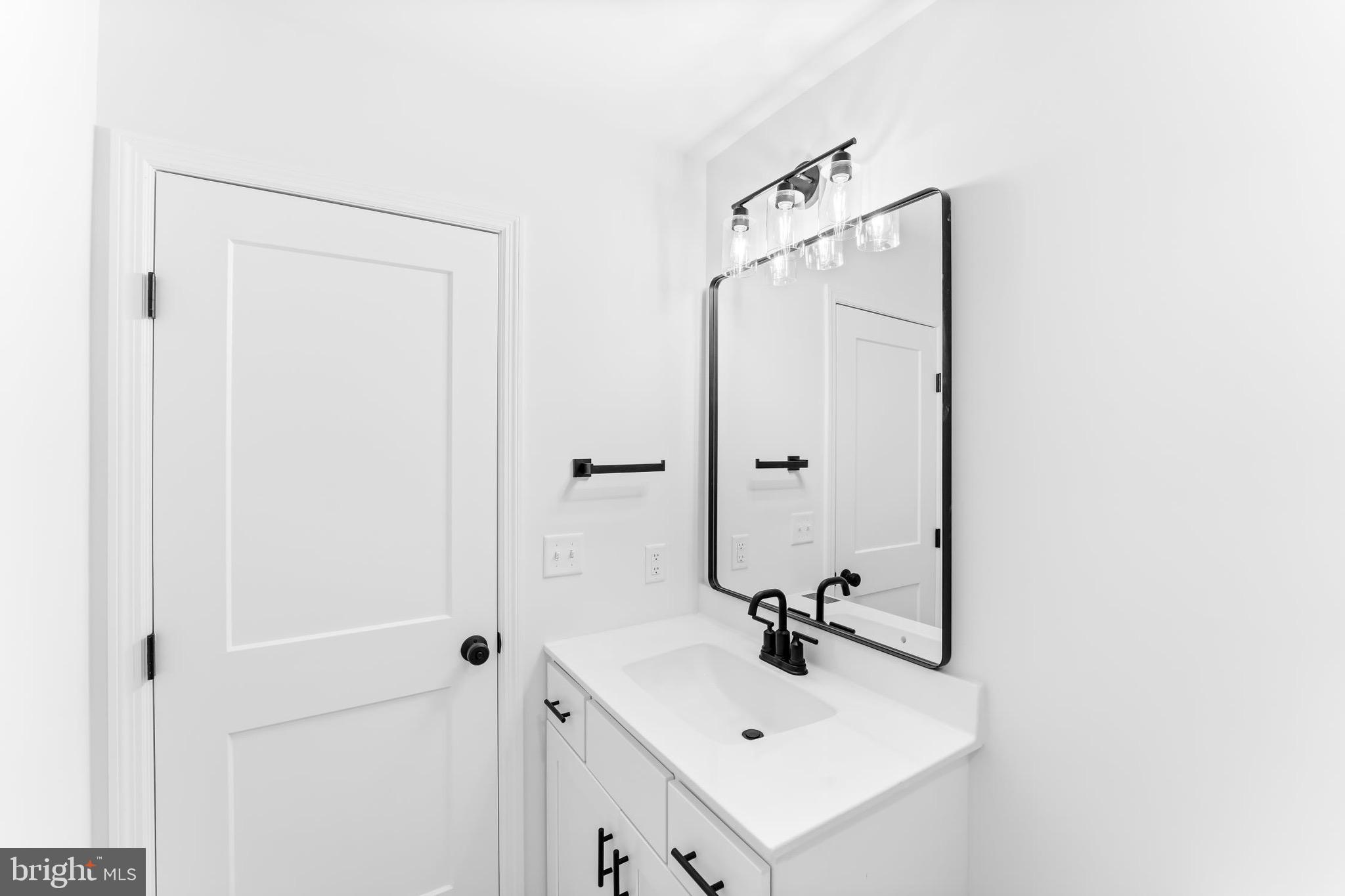 183 Ellicott Road Avondale, PA 19311 - Photo 51 of 92 a bathroom with a sink a mirror and shower