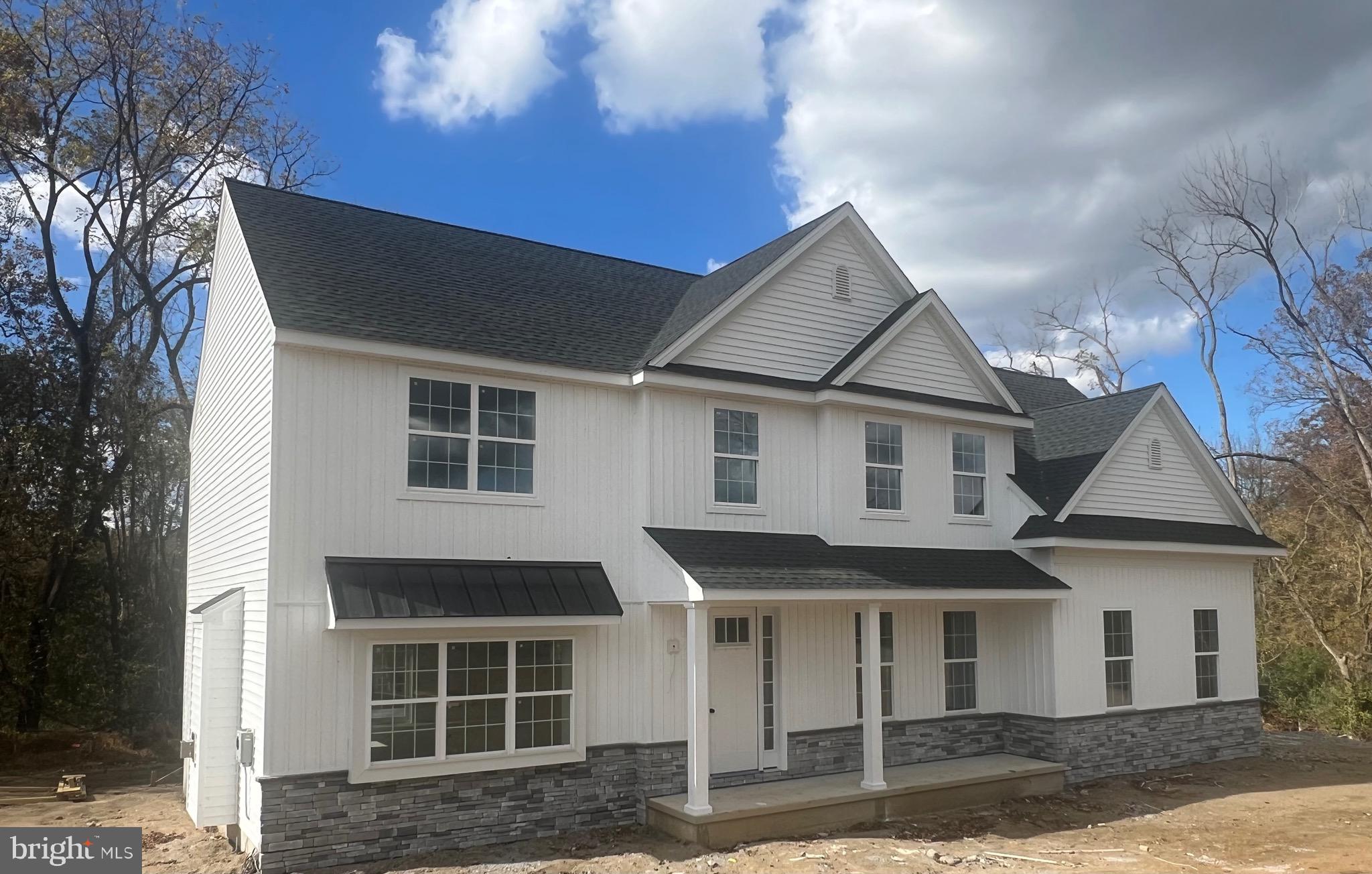 183 Ellicott Road Avondale, PA 19311 - Photo 90 of 92 a front view of a house with a yard
