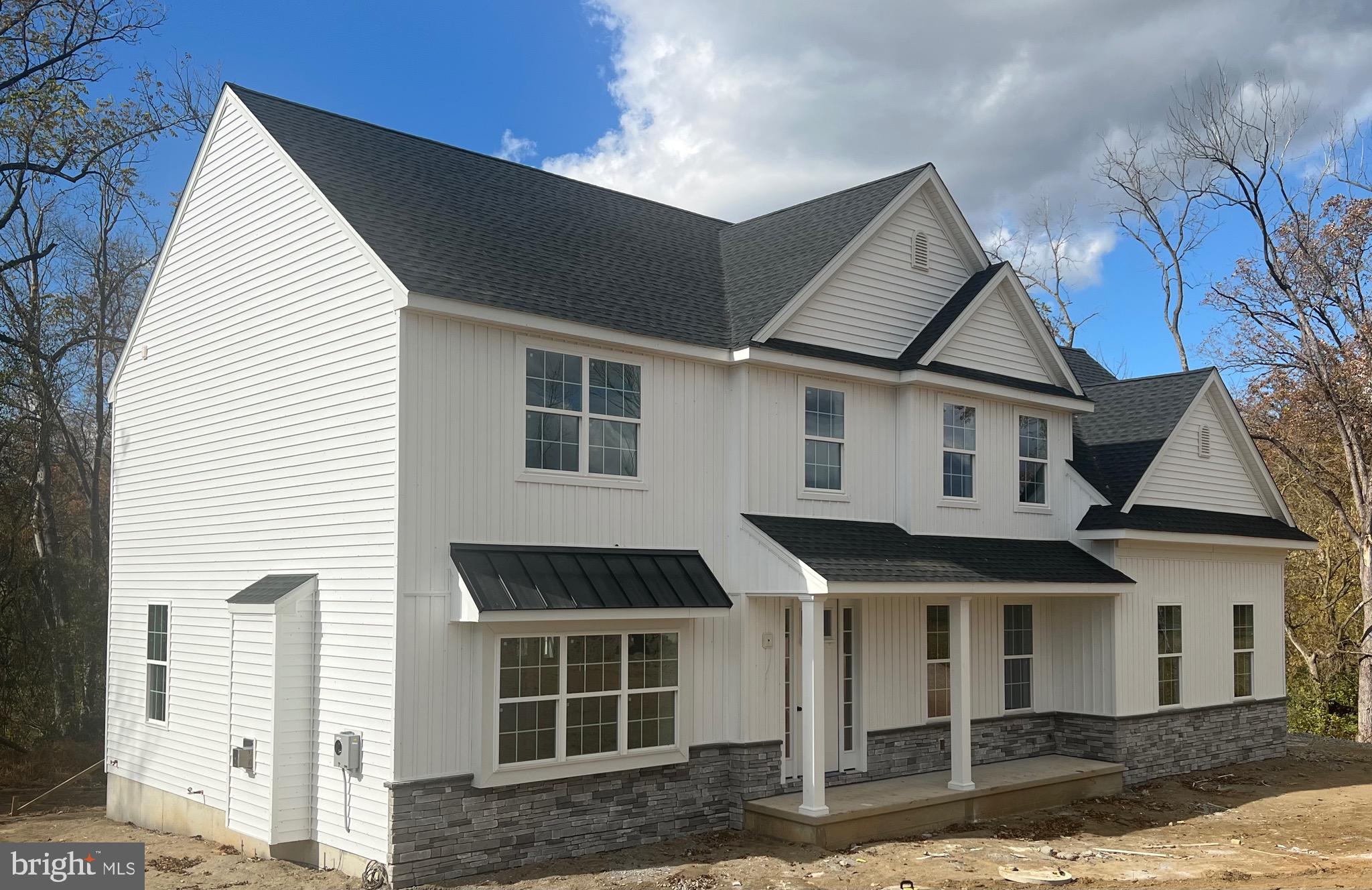 183 Ellicott Road Avondale, PA 19311 - Photo 91 of 92 a front view of a house with a yard