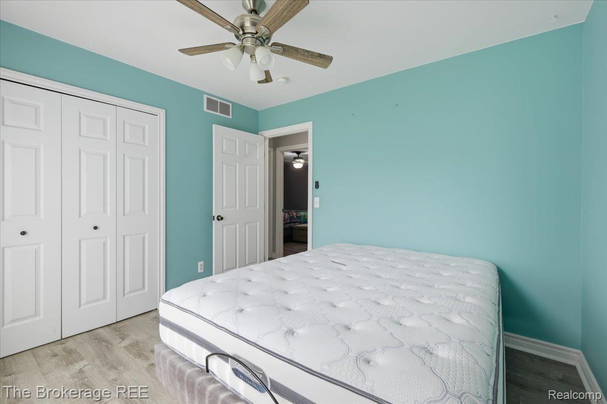 11282 Silver Lake Road Byron, MI 48418 - Photo 18 of 32 Wood-finish flooring and a ceiling fan with integrated lighting