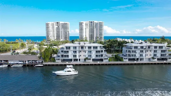 a view of a water with tall building